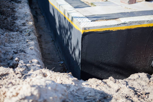 Professional Emergency Waterproofing technician working in West Sayville, NY
